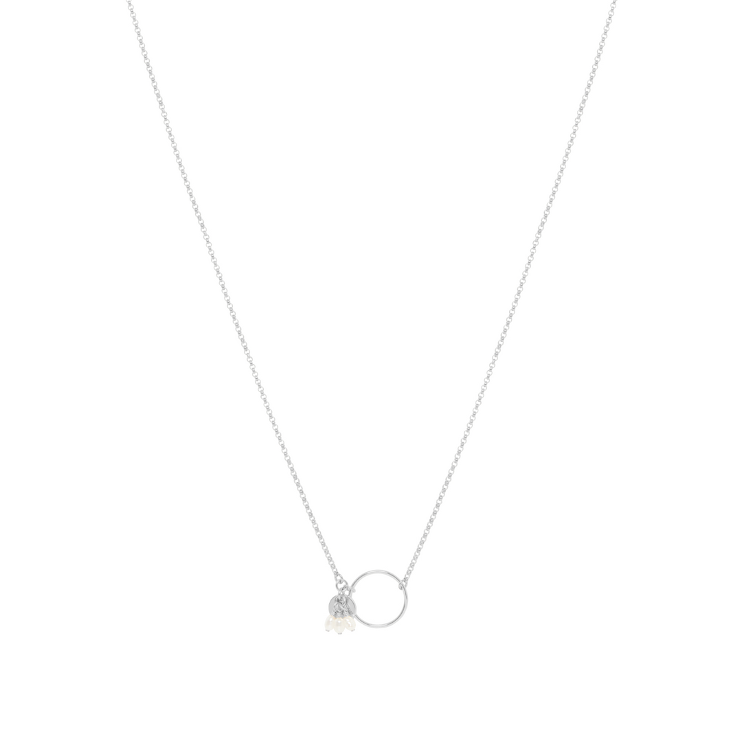 A sterling silver necklace with a fine rolo chain, a hoop centrepiece, and three freshwater pearl details.